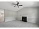 Bright living room featuring a fireplace, carpet floors and a ceiling fan at 2213 Stephanie Ln, Clayton, NC 27520