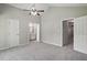 Spacious primary bedroom with plush carpet, neutral walls, vaulted ceilings, and ensuite access at 2213 Stephanie Ln, Clayton, NC 27520