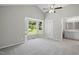 Bright primary bedroom with vaulted ceilings, neutral walls, plush carpet, and large windows at 2213 Stephanie Ln, Clayton, NC 27520