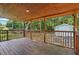 Relaxing covered porch with wood ceiling, wooden deck and backyard shed at 2213 Stephanie Ln, Clayton, NC 27520