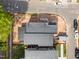 Aerial view of a modern home with a gray roof, surrounded by trees and streets at 2321 Turners Aly, Raleigh, NC 27607
