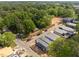 Captivating aerial shot of contemporary houses nestled among mature trees, highlighting the serene landscape and community layout at 2321 Turners Aly, Raleigh, NC 27607