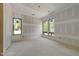 Unfinished bright and airy bedroom with large windows offering neighborhood views at 2321 Turners Aly, Raleigh, NC 27607