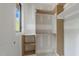 Bright closet featuring built-in shelving and a window for natural light at 2321 Turners Aly, Raleigh, NC 27607