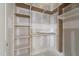 Custom closet design with multiple shelves and clothes rack at 2321 Turners Aly, Raleigh, NC 27607