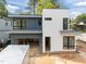 Newly constructed home featuring contemporary design, gray and white siding and black frame windows at 2321 Turners Aly, Raleigh, NC 27607
