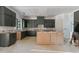 Unfinished spacious kitchen with custom green cabinetry and large center island at 2321 Turners Aly, Raleigh, NC 27607