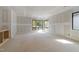 Unfinished living room featuring a large window and built in cabinet at 2321 Turners Aly, Raleigh, NC 27607