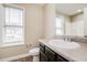 Bathroom featuring a single sink vanity, toilet, and a large window for natural light at 234 Lars Ln, Garner, NC 27529
