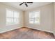 Bright bedroom featuring two windows and neutral carpeting and paint at 234 Lars Ln, Garner, NC 27529