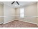 Bedroom features neutral carpet, window for natural light, and base molding at 234 Lars Ln, Garner, NC 27529