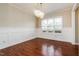 Dining room with hard wood floors, decorative lighting, and large window at 234 Lars Ln, Garner, NC 27529