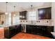 Well-equipped kitchen with granite countertops, stainless steel appliances, and dark wood cabinetry at 234 Lars Ln, Garner, NC 27529
