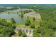 Aerial view of the community, showcasing the pond and lush landscaping surrounding the homes at 2404 Azalea Dr, Durham, NC 27703