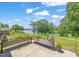 Enjoy outdoor living on the patio with planter, with relaxing views of the lake and lush landscape at 2404 Azalea Dr, Durham, NC 27703