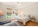 Bedroom with natural light, hardwood floors, complemented by an area rug at 2404 Azalea Dr, Durham, NC 27703
