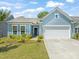 Inviting home with beautiful curb appeal and an attached two-car garage at 2404 Azalea Dr, Durham, NC 27703