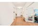 Inviting foyer with hardwood floors and ample natural light leads to office and main living areas at 2404 Azalea Dr, Durham, NC 27703