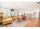 Bright, open living space featuring hardwood floors, a comfortable seating area, and access to the kitchen at 2404 Azalea Dr, Durham, NC 27703