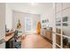 Cozy office with a window, a desk, and hardwood floors at 2404 Azalea Dr, Durham, NC 27703