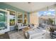 Covered porch offers ample seating, creating an inviting and comfortable outdoor living space at 2404 Azalea Dr, Durham, NC 27703