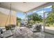Bright and airy sunroom featuring comfortable seating, natural light, and scenic outdoor views at 2404 Azalea Dr, Durham, NC 27703