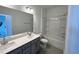 Bathroom boasts double sinks, a large mirror, and a shower/tub combo at 2411 Whitewing Ln, Wendell, NC 27591