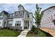 Charming two-story home with stone accents, covered porch, and well-maintained landscaping at 2411 Whitewing Ln, Wendell, NC 27591