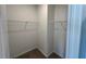 Walk-in closet with ample shelving for organized storage at 2411 Whitewing Ln, Wendell, NC 27591