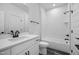 Modern bathroom featuring a white vanity, matte black fixtures, and a bathtub with white subway tile at 2617 Packhouse Rd, Zebulon, NC 27597