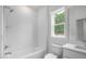 Bathroom featuring tub/shower combo and single sink vanity at 2617 Packhouse Rd, Zebulon, NC 27597