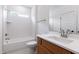 Bathroom featuring a bathtub with shower, a white countertop, and wood cabinets at 2617 Packhouse Rd, Zebulon, NC 27597