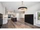Spacious open-concept kitchen flowing into the dining area with modern finishes and appliances at 2617 Packhouse Rd, Zebulon, NC 27597