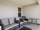 View of neutral-toned covered back patio, complete with cozy seating at 304 Anaconda Trl, Mebane, NC 27302