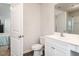 Clean, well-lit bathroom with white vanity, toilet, and view of the bedroom at 304 Anaconda Trl, Mebane, NC 27302