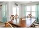 Dining room with bright light, wooden table with seating for six, and sliding glass doors at 304 Anaconda Trl, Mebane, NC 27302