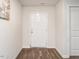 Clean entryway with a white front door, wood-look flooring, and neutral wall color at 304 Anaconda Trl, Mebane, NC 27302