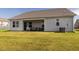 Exterior view of home featuring covered back patio and lush backyard at 304 Anaconda Trl, Mebane, NC 27302