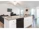 Open kitchen with granite countertops, white cabinetry, and views to the living room at 304 Anaconda Trl, Mebane, NC 27302