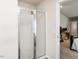 Shower stall with glass doors, tile surround, and view of bedroom at 304 Anaconda Trl, Mebane, NC 27302