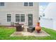 A patio area features an outdoor sofa and chiminea in a private backyard at 313 Weeping Willow Dr, Durham, NC 27704