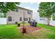 The vinyl-sided home has a paved backyard patio with room for grilling and a privacy fence at 313 Weeping Willow Dr, Durham, NC 27704