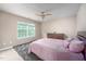 A cozy bedroom featuring natural light from the window and a chest of drawers at 313 Weeping Willow Dr, Durham, NC 27704