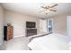 Spacious bedroom with ceiling fan and attached bathroom at 313 Weeping Willow Dr, Durham, NC 27704