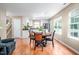 Open-concept dining room next to the kitchen with a table for four at 313 Weeping Willow Dr, Durham, NC 27704