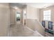 Well-lit upstairs hallway with carpeted floors, access to bedrooms, and an attic access panel at 313 Weeping Willow Dr, Durham, NC 27704