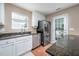 Close-up of the kitchen with stainless steel appliances, granite countertops, and an undermounted sink at 313 Weeping Willow Dr, Durham, NC 27704