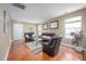 Bright living room with hardwood floors and neutral-toned walls at 313 Weeping Willow Dr, Durham, NC 27704