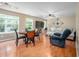 Combined dining and living area featuring stylish furniture and plenty of natural light at 313 Weeping Willow Dr, Durham, NC 27704