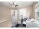 A versatile room features a desk, file cabinet, and closet with neutral walls and carpet at 313 Weeping Willow Dr, Durham, NC 27704